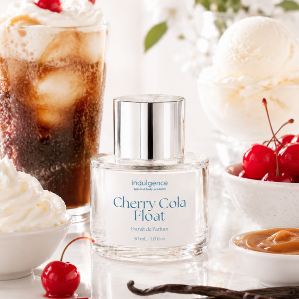 Perfume bottle labeled 'Cherry Cola Float' with a cherry cola float and vanilla beans in the background.